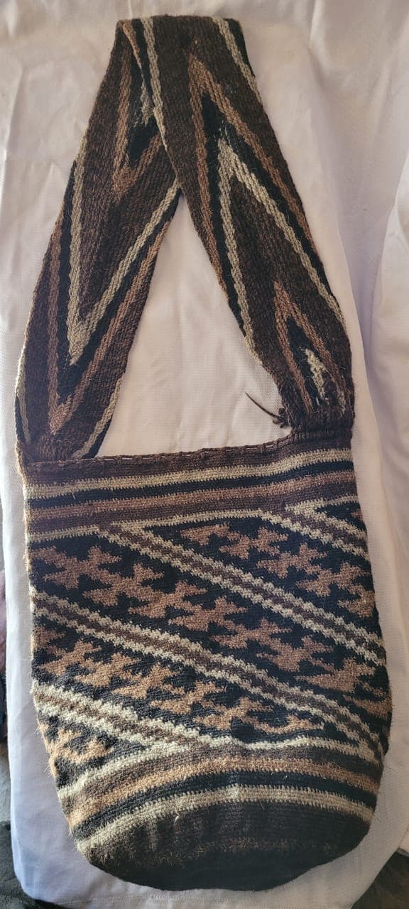 Traditional Arhuaco mochila with intricate geometric weaving patterns